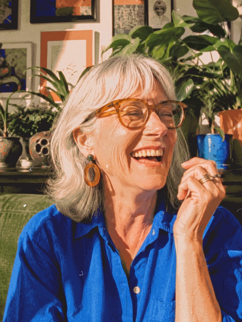 A grandmother laughing in her garden